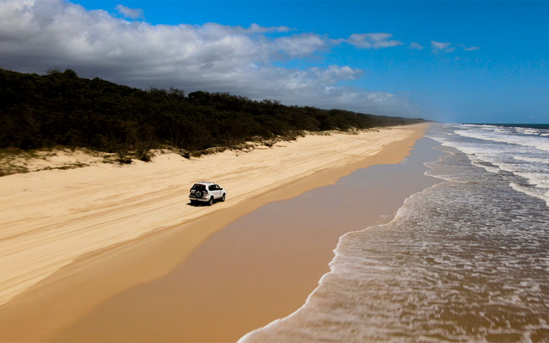 4WD Driving down Beach on Fraser Island