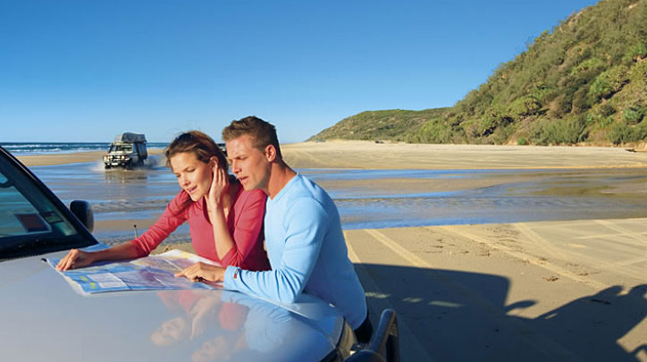 Couple on Fraser Island Beach with 4WD